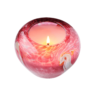A beautiful scented pink color hand-blown glass artisan candle from Laguna Candles